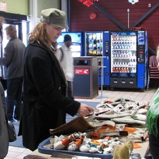 Fair trade sale (1) Lynette and Marian look at items for sale with Lana overseeing the table. 